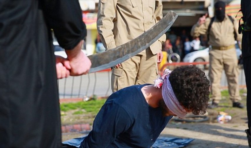 Three men are beheaded with blood-covered sword by ISIS