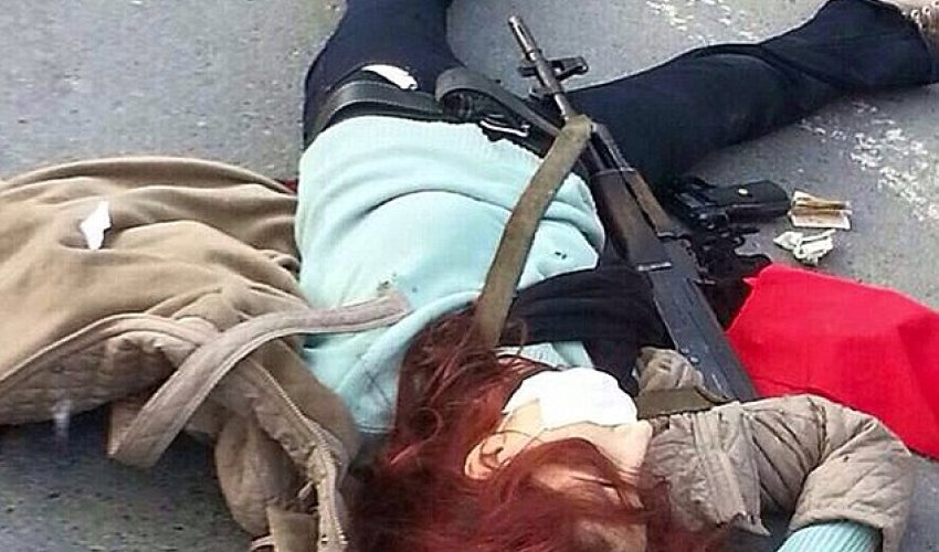 Woman wielding assault rifle and grenades is shot dead Woman wielding assault rifle and grenades is shot dead