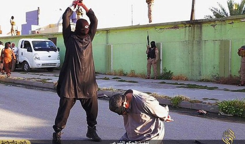 ISIS executioners behead three men accused spying for the government