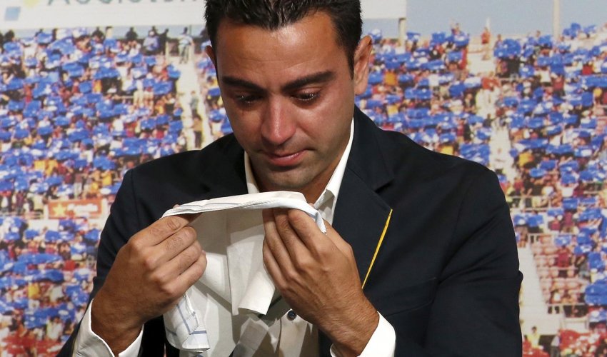 Barcelona's Xavi weeps during farewell tribute