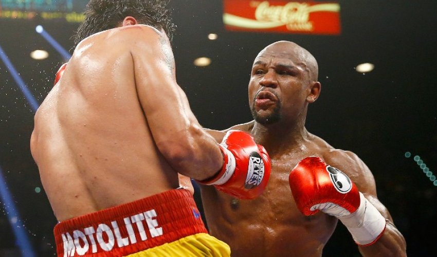 Floyd Mayweather and Manny Pacquiao punch above weight