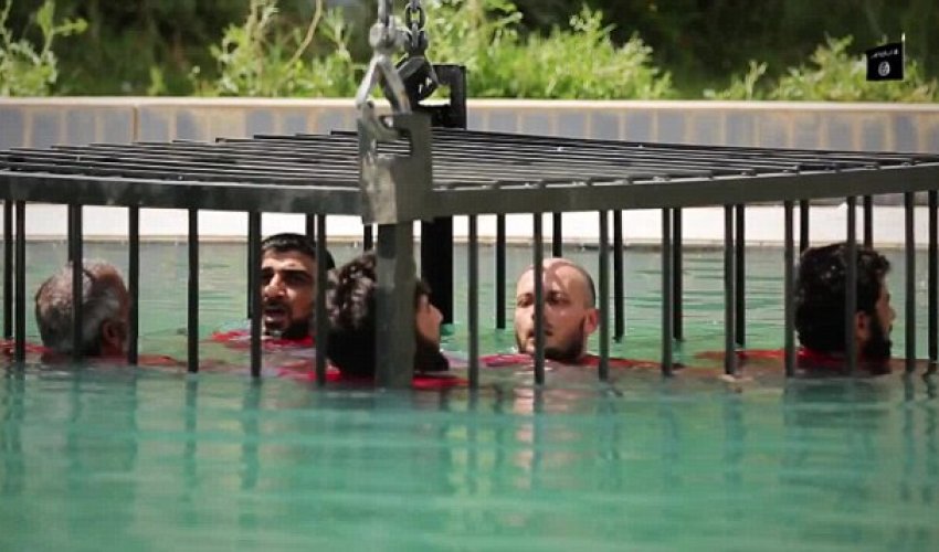 Sickening new ISIS video shows caged prisoners