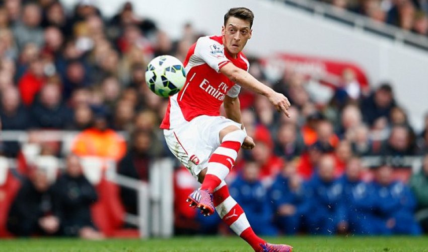 Arsenal midfielder Mesut Ozil shows his caring side