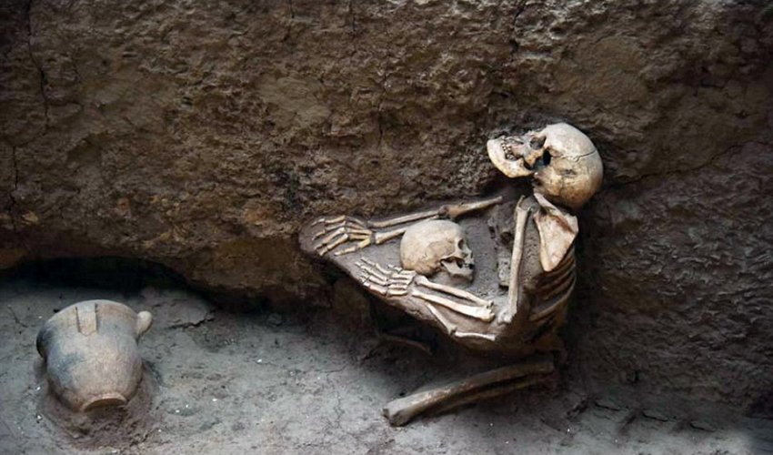 4,000-year-old skeletons of mother and child are found locked