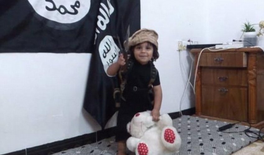 Shocking new ISIS video shows baby-faced three-year-old boy behead his TEDDY BEAR