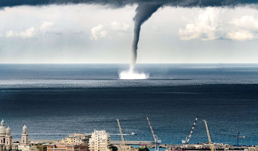 Incredible moment a massive waterspout descended on Italian coastal town