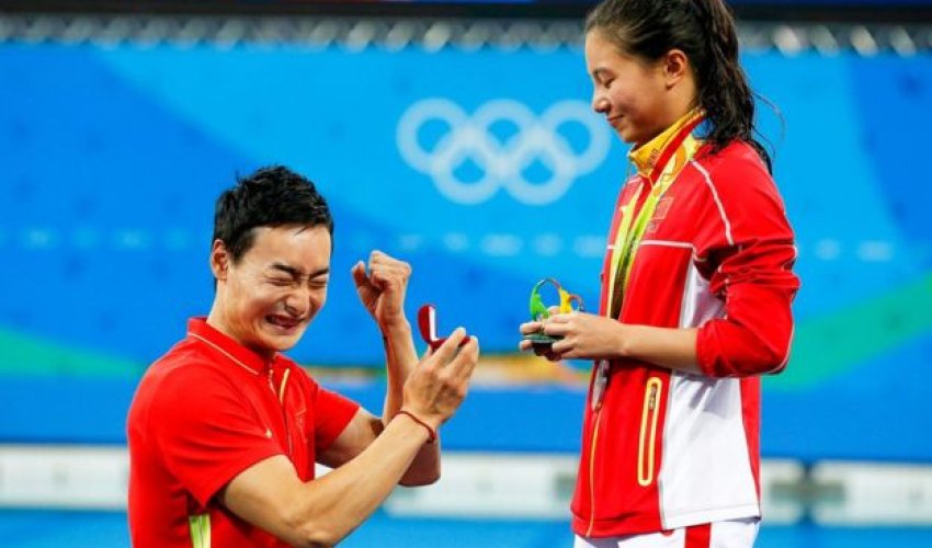 A marriage proposal at the Olympics medal ceremony