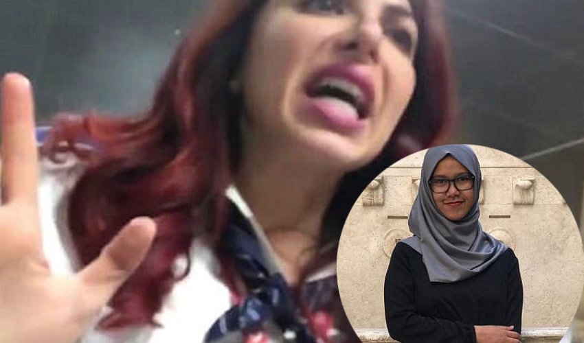 Müsəlman qızın hicabını çıxardılar Müsəlman qızın hicabını çıxardılar