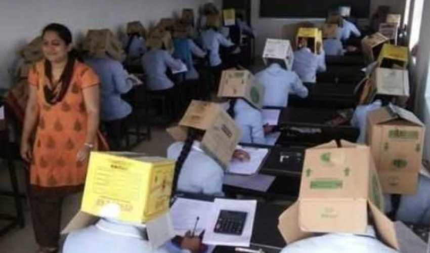 Tələbələrin başlarına qutu keçirib imtahana saldılar — FOTO