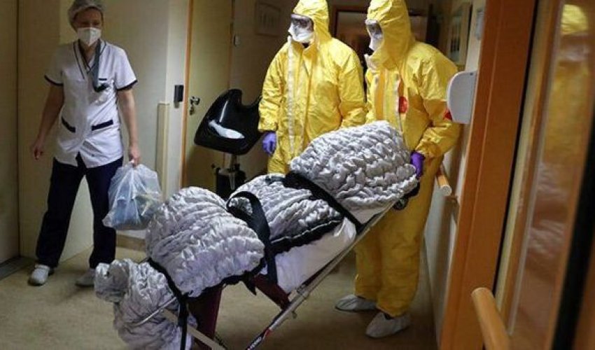 Koronavirusdan ölən adamın tabutunu sobada yandırırlar - FOTO