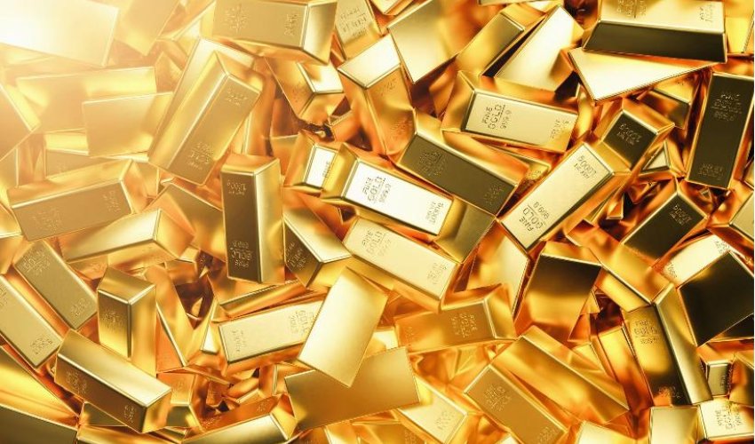 Gold prices hover near record highs as global demand surges