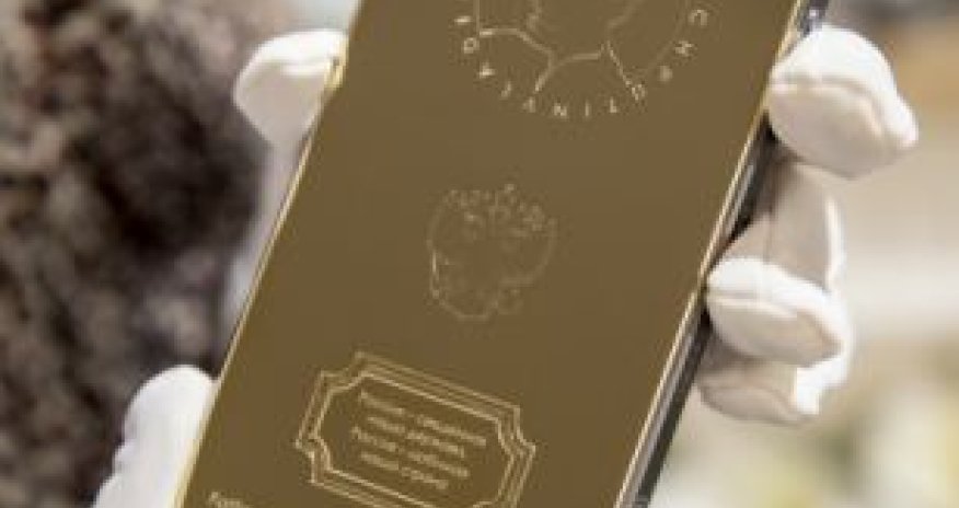 Gold iPhone with engraving of Vladimir Putin's head goes on sale for £2,500 - PHOTO