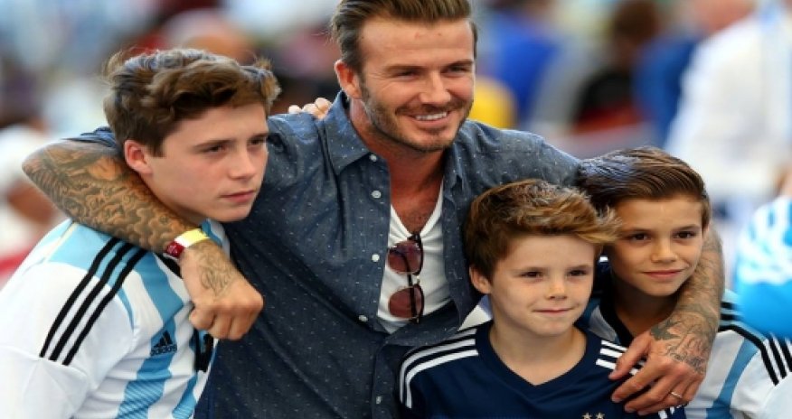 Beckham and sons showing their allegiances at the Maracana