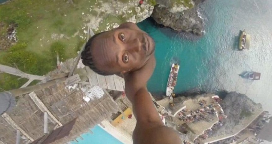 Video shows brave Jamaican make extreme dive off 100ft cliff - VIDEO