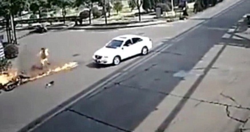 Motorbike rider is turned into human fireball after hitting car... and SURVIVES - VIDEO