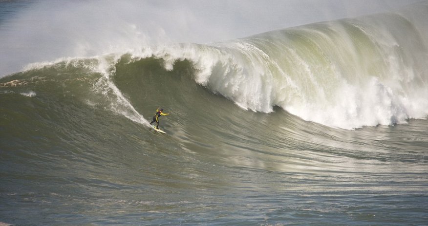 Thrill-seeker surfs through incredible waves