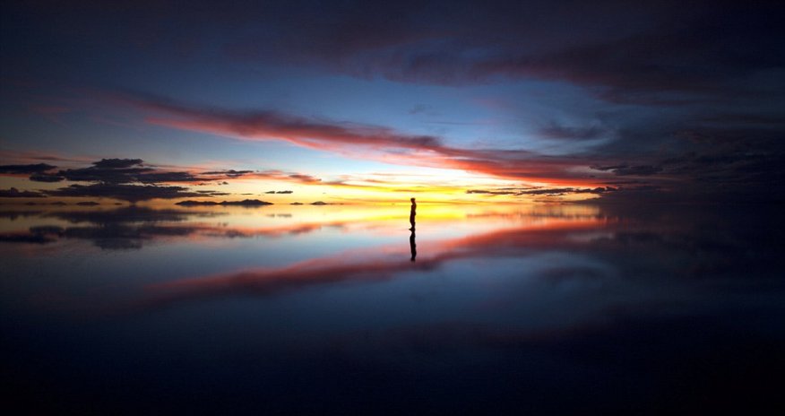 Skylines reflected in water create a dream-like background - PHOTO