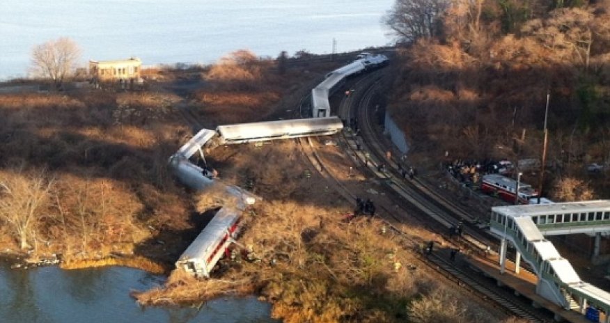 Four dead and 63 injured as all seven cars of a NYC commuter train fly off the rails