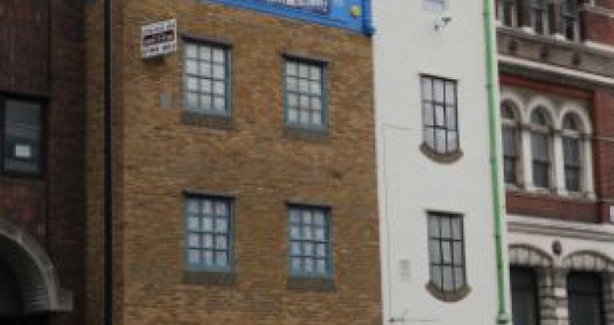 Artist turns the world on its head by creating an upside down building - PHOTO