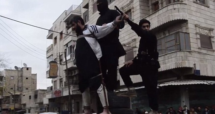 ISIS release horrific photos of a man having his hand amputated for theft