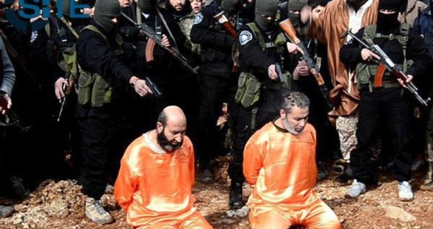 ISIS publicly executes two 'spies' and CRUCIFIES another