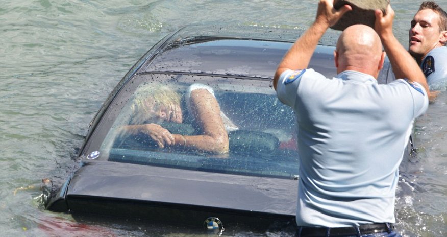 Police smashed their way into a woman's sinking BMW