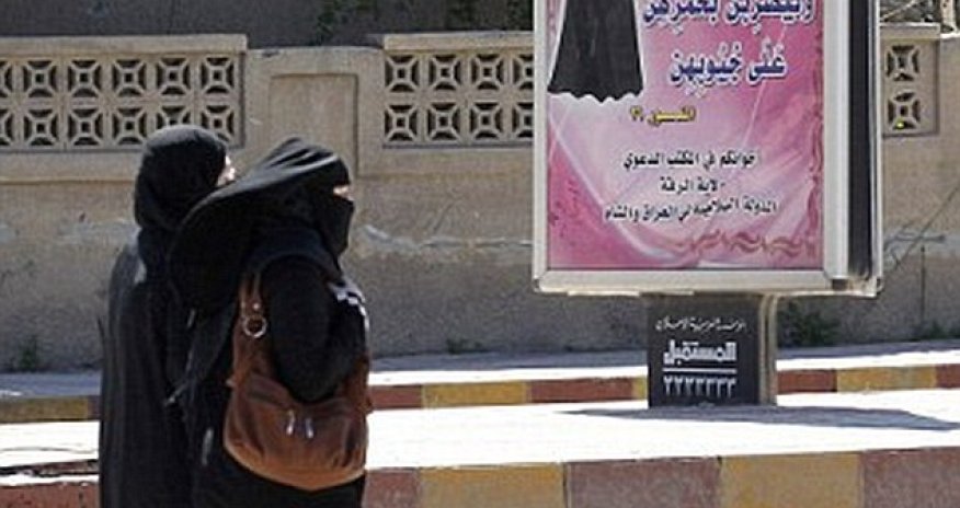 ISIS morality police arrest a woman wearing full burkha and face veil