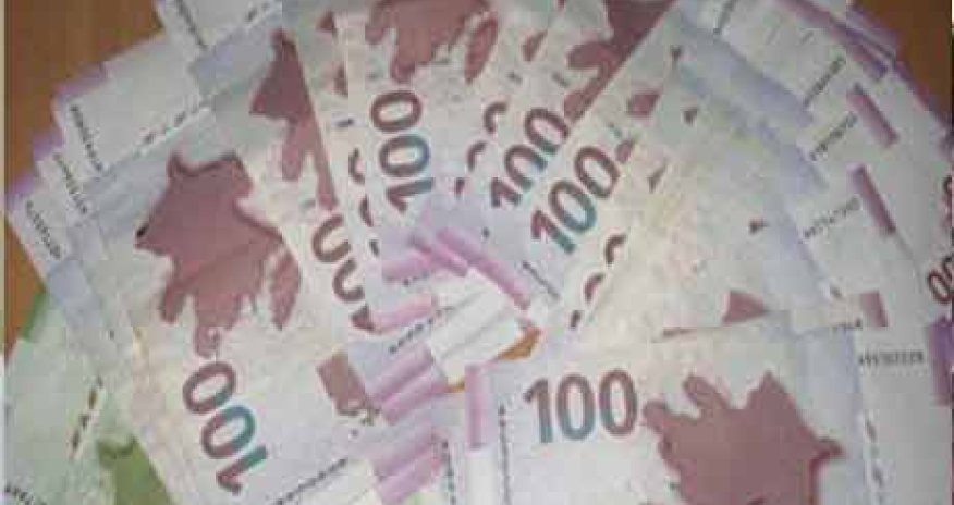 Azeri central bank devalues currency by 33.5 pct to dollar