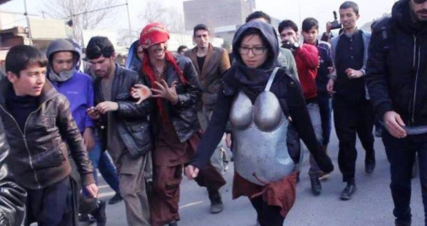 Woman in armour protesting against sexual harassment pelted with rocks