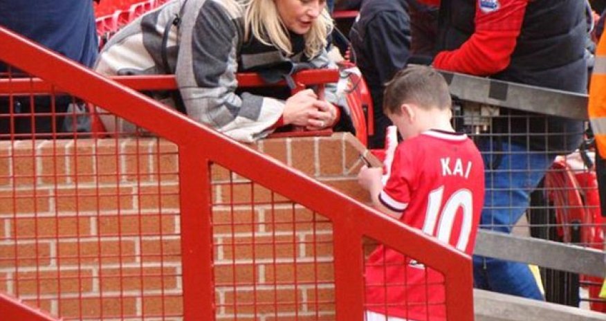 Kai Rooney, five, is asked for his AUTOGRAPH