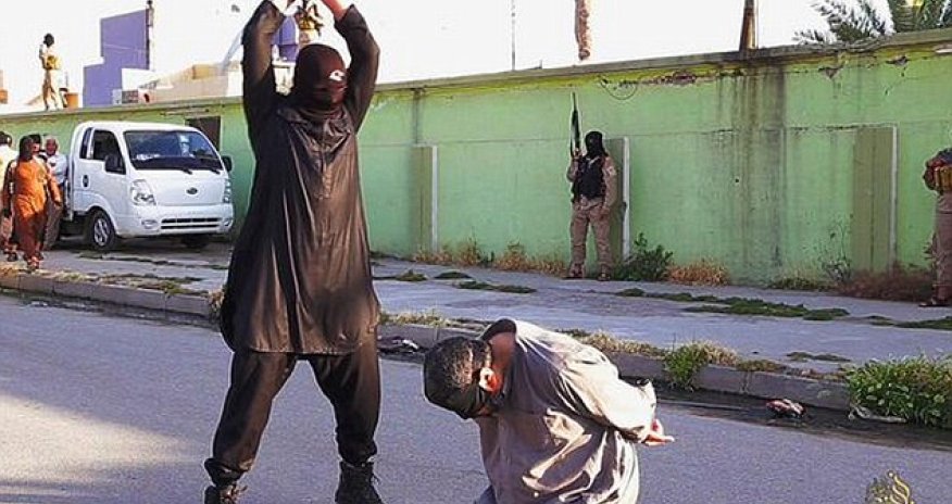 ISIS executioners behead three men accused spying for the government