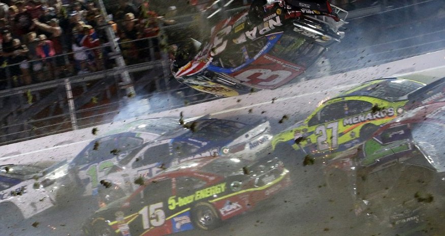 NASCAR driver flips over racetrack before smashing into fence at 200mph