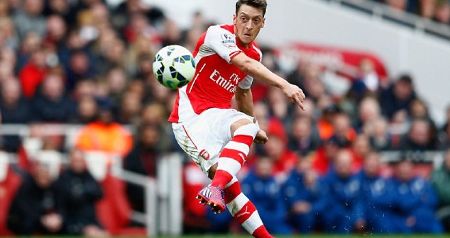 Arsenal midfielder Mesut Ozil shows his caring side