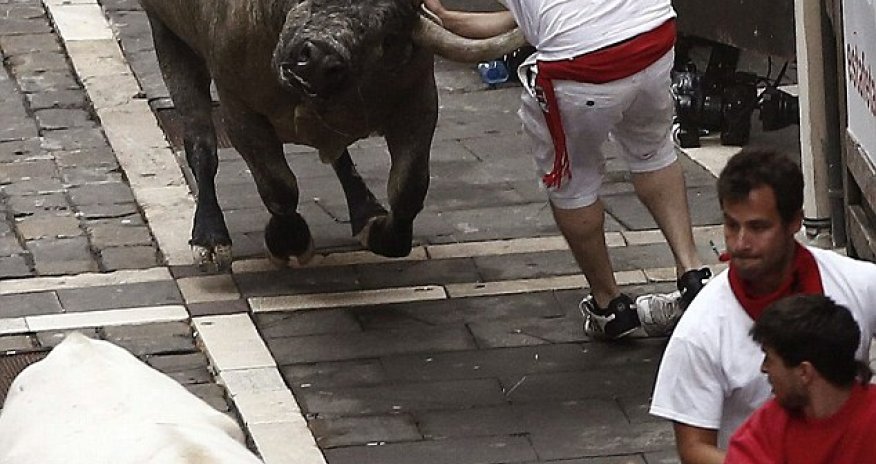 Runner is gored by a bull during the annual festival in Pamplona