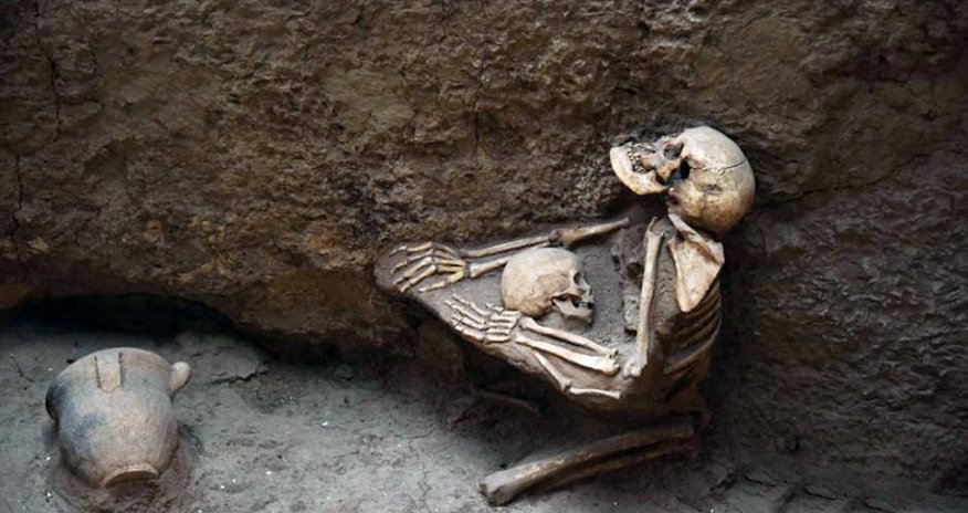 4,000-year-old skeletons of mother and child are found locked