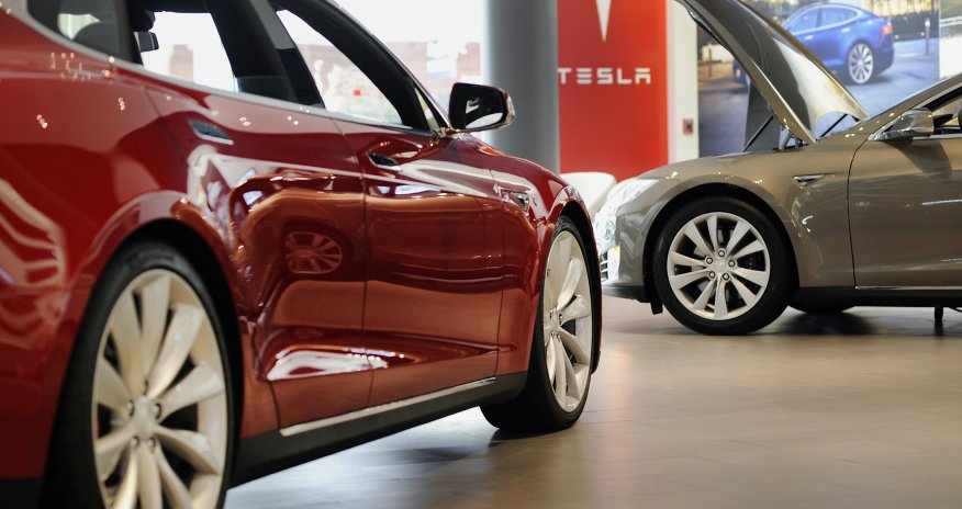 Thanks for buying a $100,000 Tesla. Want a tote bag with that?