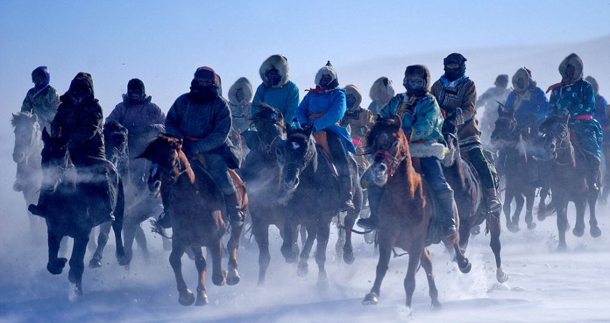 Stunning photos of Mongolian herdsmen galloping through the bitter cold on horseback