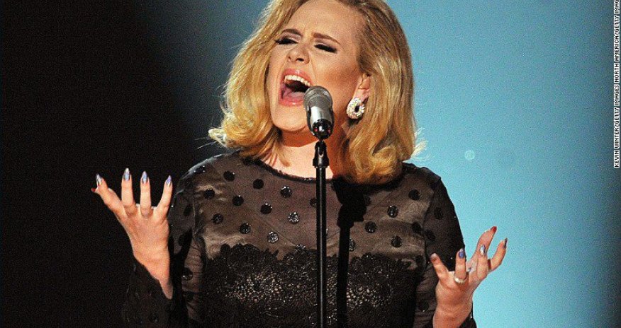 Adele big winner at BRIT Awards as industry pays tearful tribute to Bowie