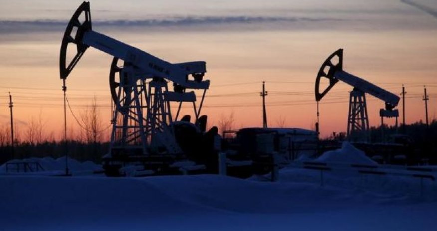 Oil jumps as sentiment gets boost, but analysts warn of ongoing glut