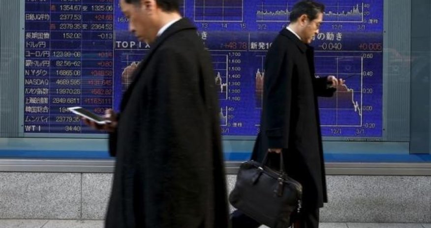 Asian shares slide, frazzled by Fed, falling oil prices