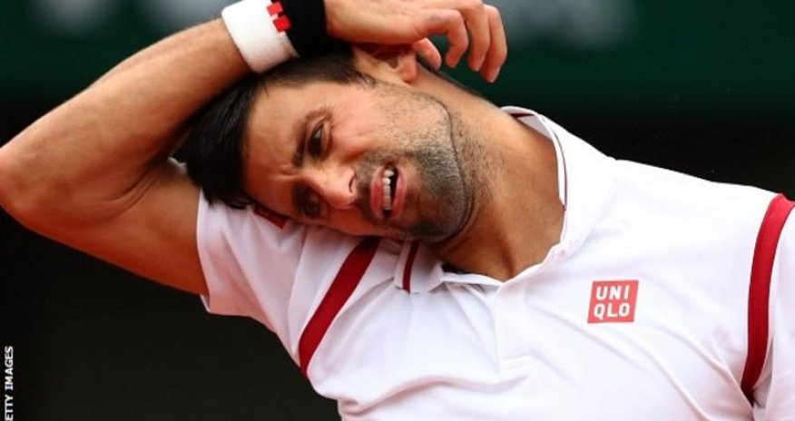 Novak Djokovic leads Roberto Bautista Agut when rain returns