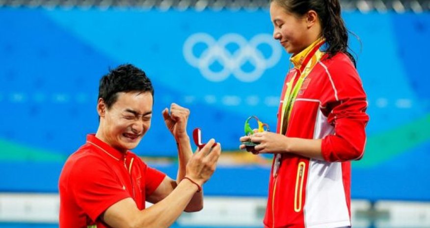 A marriage proposal at the Olympics medal ceremony