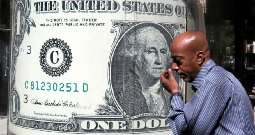 Dollar recedes from seven-month peak, lifts oil