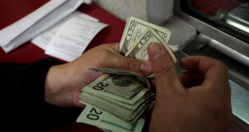 Dollar stays near 13-and-a-half year peak