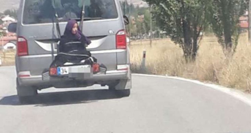 Qızı yük kimi avtobusun arxasına bağlayıb... - VIDEO 