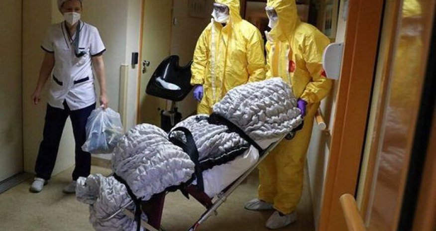 Koronavirusdan ölən adamın tabutunu sobada yandırırlar - FOTO