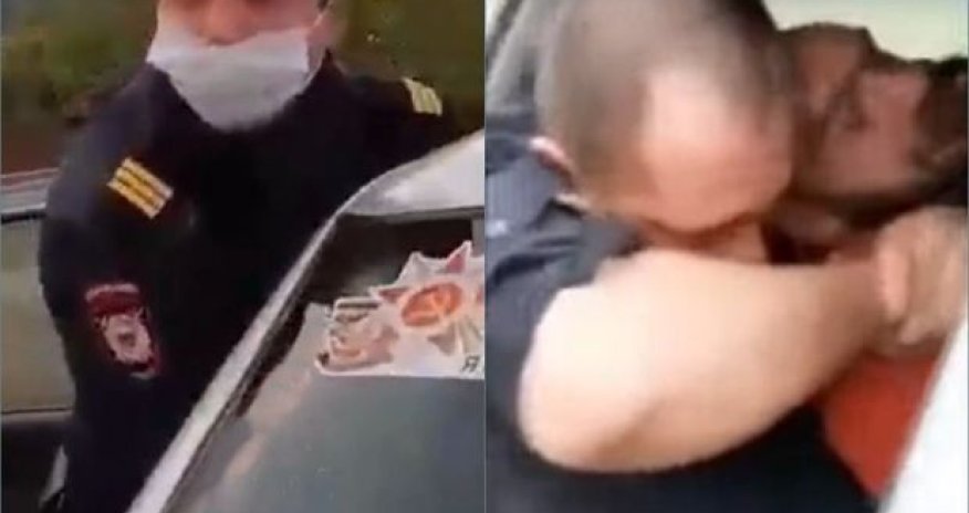 Rusiyada polis xidməti maşında şübhəlini boğmağa cəhd etdi - VİDEO