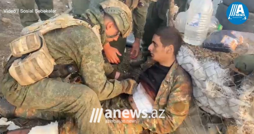 Azərbaycan əsgərləri yaralanmış erməni əsgərinə kömək edir - VİDEO