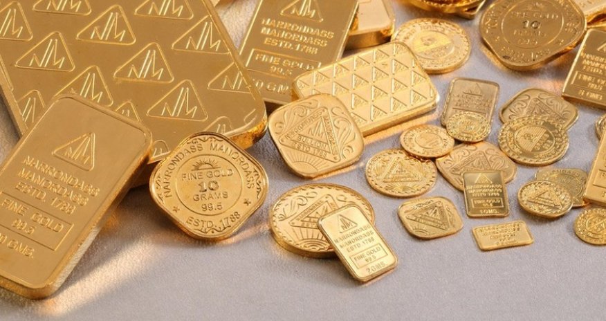 Gold prices hit $1,700 per troy ounce